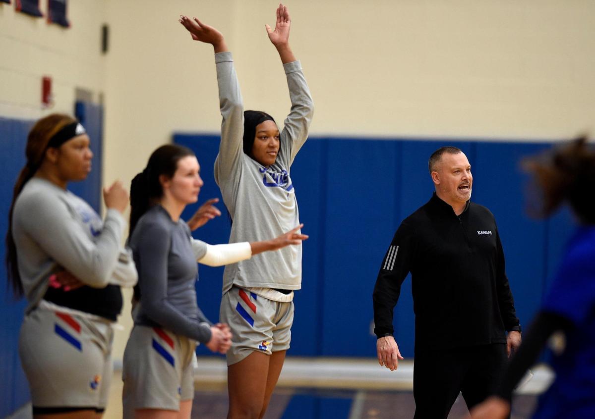 KU women’s basketball coach Brandon Schneider, right, and 6’-6” Taiyanna Jackson, left, have led the Jayhawks to a 19-5 record this season. They are currently in third position in the Big 12 standings with a league record of 10-4.