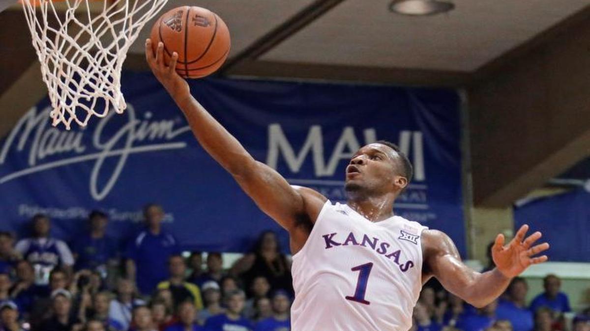 Kansas guard Wayne Selden (1) went to the basket over Vanderbilt forward Jeff Roberson in the first half of the Maui Invitational championship game on Wednesday in Lahaina, Hawaii.