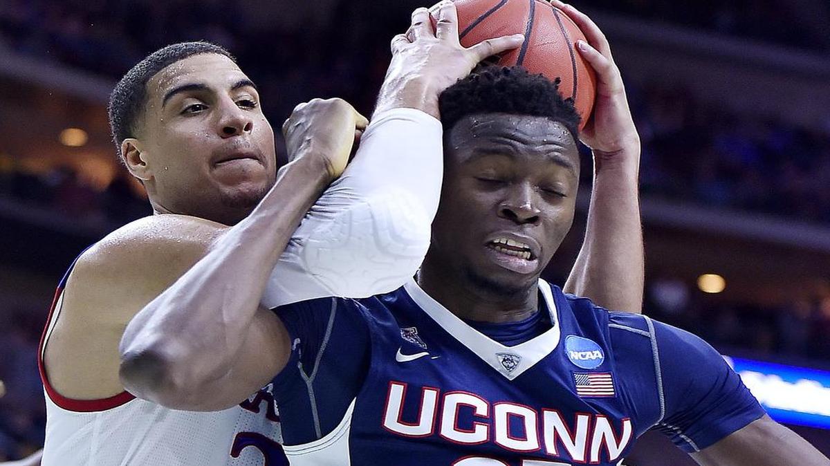 Landen Lucas (left) led KU in rebounding as a junior — here he grabbed one of 12 against Connecticut in the NCAA Tournament — but wants to improve his offense this season.