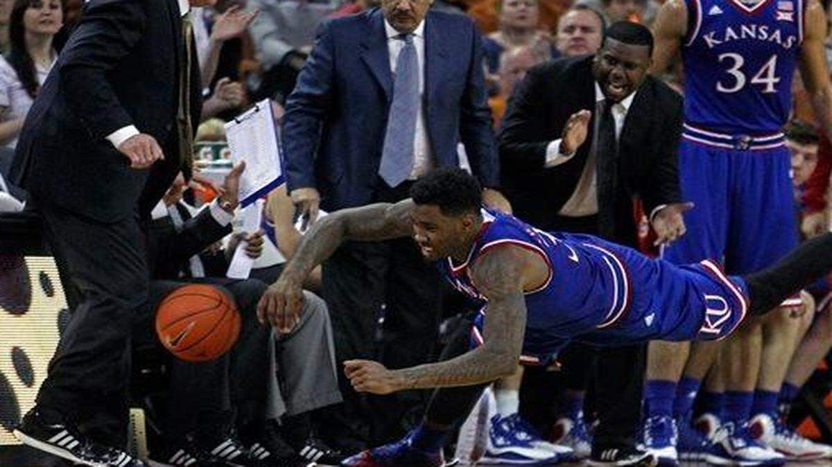 
Kansas’ Jamari Traylor dived for a loose ball during Saturday’s basketball game against Texas in Austin.
