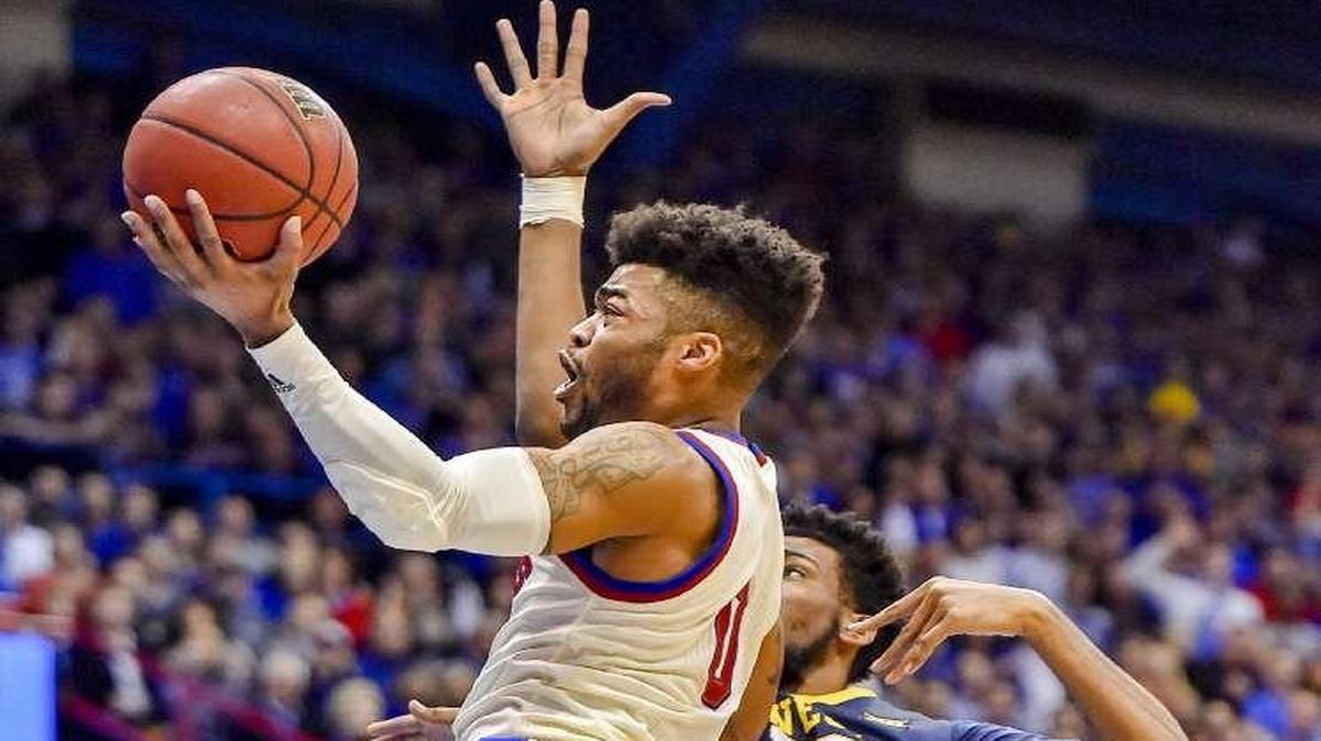 “We told him to keep driving it,” KU coach Bill Self said of guard Frank Mason (right) in Monday’s game against West Virginia. Mason ended up shooting 18 free throws, making 16 of them in the Jayhawks’ 84-80 overtime victory.
