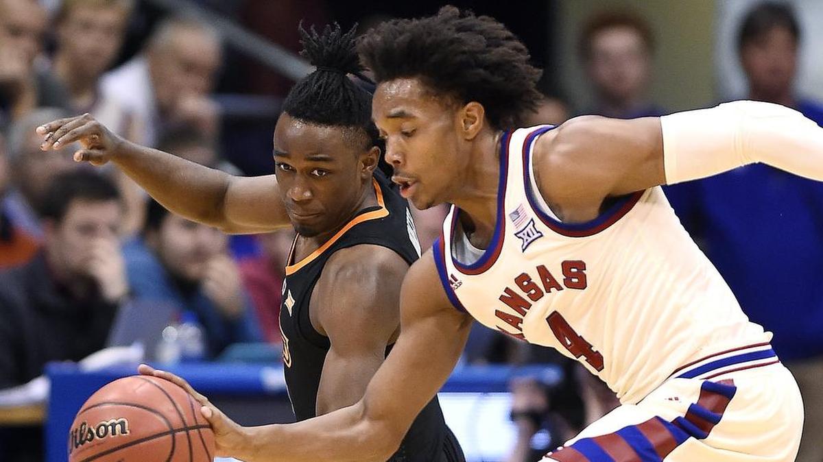 Devonté Graham (right) is the third player in KU history to reach 1,400 points, 500 assists and 175 steals.