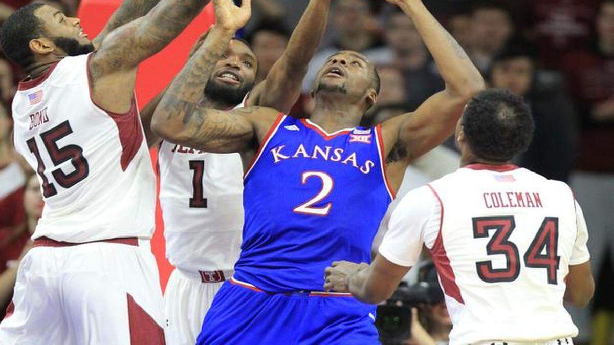 
Three Temple players surrounded Kansas freshman Cliff Alexander in a fight for the rebound in KU’s 77-52 loss to Temple on Dec. 22 in Philadelphia.
 
