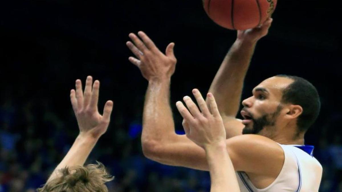 Kansas forward Perry Ellis (right) shot over Holy Cross center Matt Husek during the first half Wednesday in Lawrence. Recruit Josh Jackson will be in Lawrence to watch Ellis and the Jayhawks on Jan. 23.