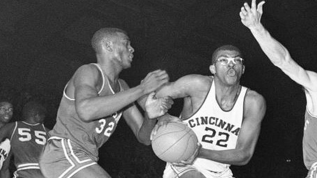 
KU’s Bill Bridges (left) helped surround Cincinnati’s Paul Hogue during a 1960 NCAA Tournament game in Manhattan, Kan.
