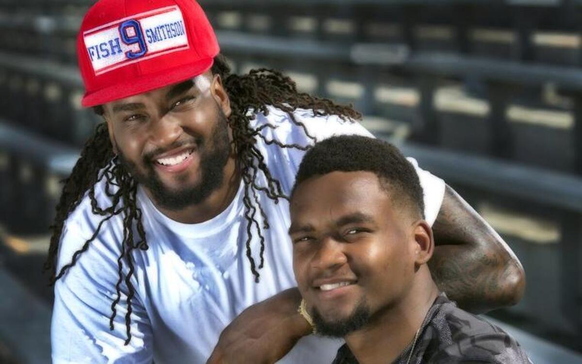 Kansas safety Fish Smithson (right) with his brother Shaky, who played wide receiver at Utah.
