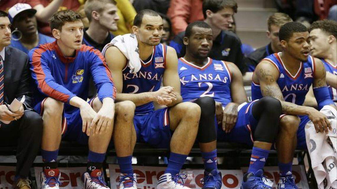 
Kansas forward Perry Ellis (second from left) sat on the bench in the first half of the Jayhawks’ 86-81 loss to Iowa State on Saturday in Hilton Coliseum in Ames, Iowa.
