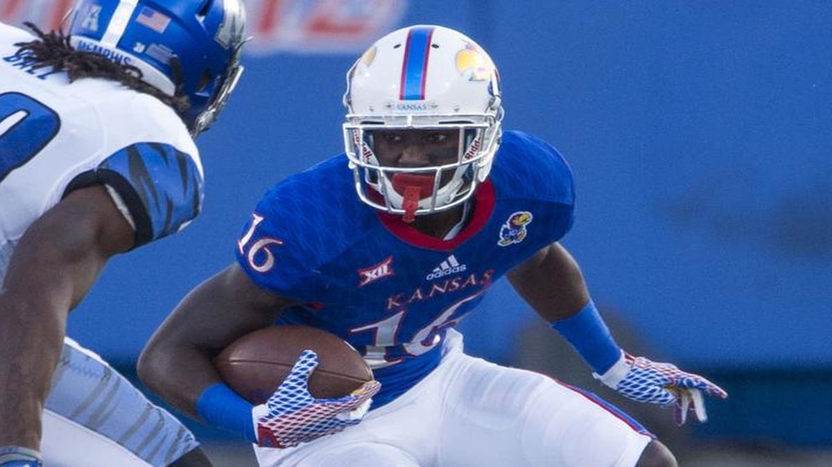 KU wide receiver Steven Sims (right) changed his number from 16 to 11 in the offseason.