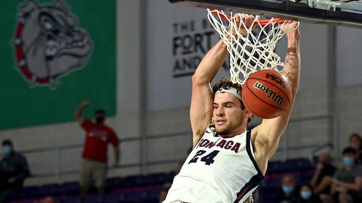 Gonzaga’s Corey Kispert dunks in front of Kansas defenders during a 102-90 victory over the Jayhawks on Thursday at the Rocket Mortgage Fort Myers Tip-Off at Suncoast Credit Union Arena in Fort Myers, Fla.