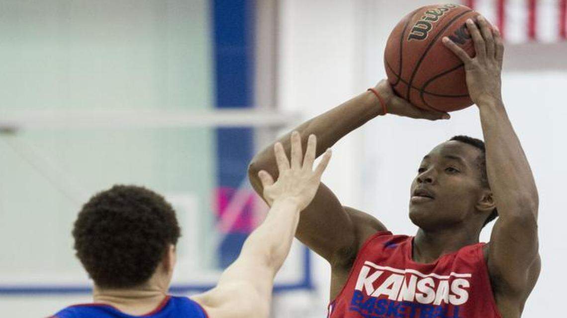 
Devonte’ Graham (right) is averaging just 5.3 points and 2.3 assists in 16.3 minutes per game, but his presence has re-invigorated KU on both ends of the floor. 
