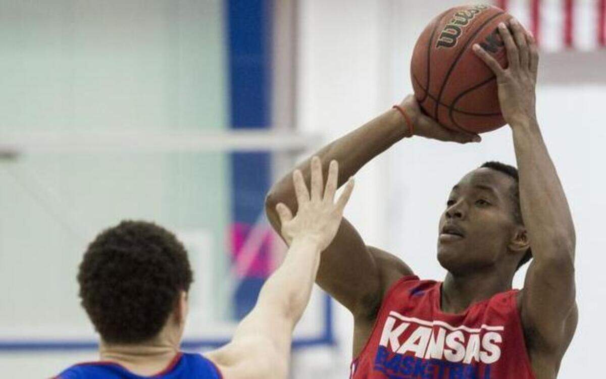 
Devonte’ Graham (right) is averaging just 5.3 points and 2.3 assists in 16.3 minutes per game, but his presence has re-invigorated KU on both ends of the floor. 
