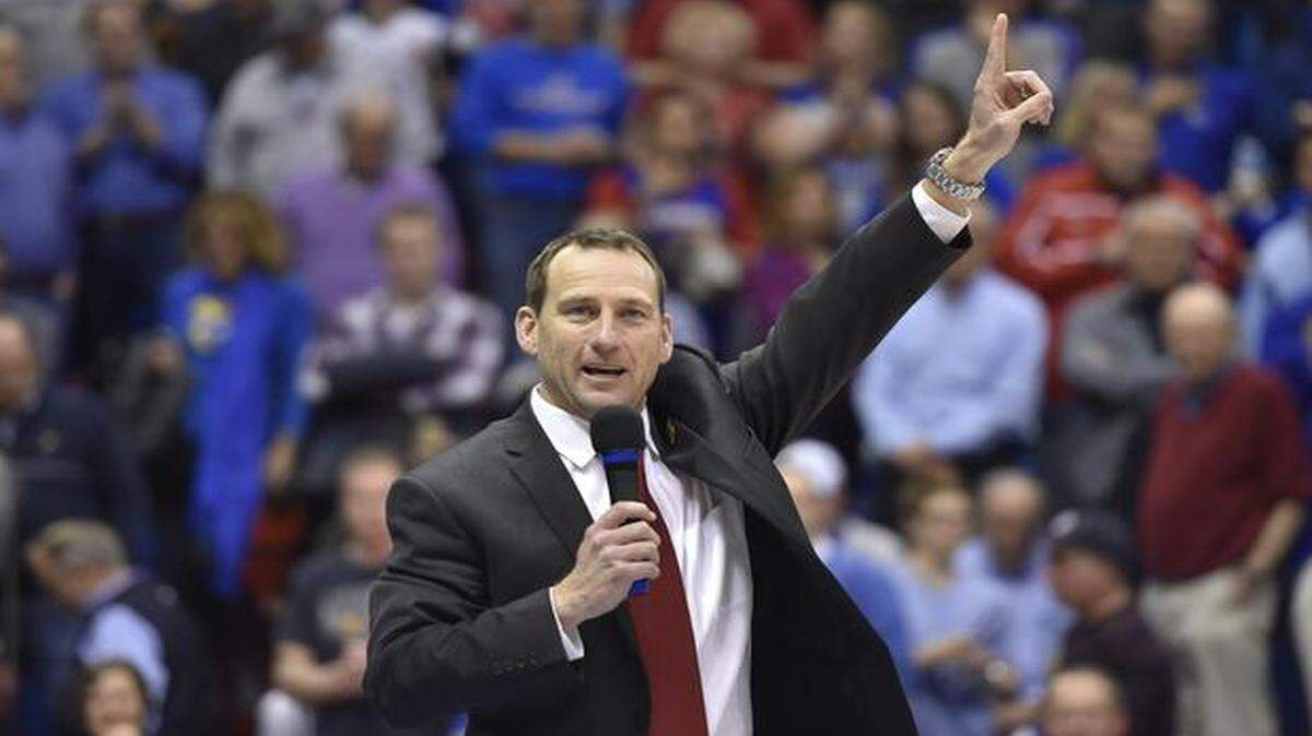 
David Beaty was introduced as the new Kansas football coach at halftime of the Jayhawks’ basketball game against Florida. “I won’t sleep,” Beaty said, “until we give you something to be proud of.”
