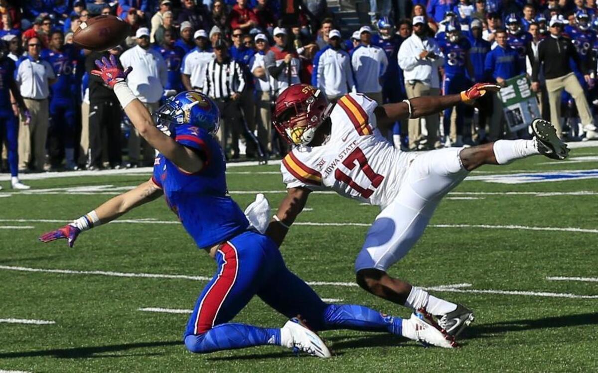 Iowa State defensive back Jomal Wiltz (17) is called for pass interference against Kansas wide receiver Tyler Patrick (4) during the first half of an NCAA college football game in Lawrence, Kan., Saturday, Nov. 12, 2016.