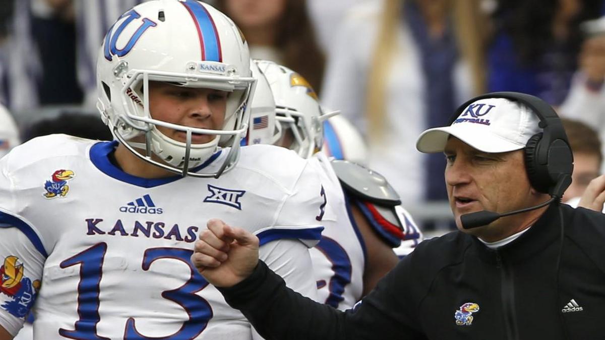 Kansas head coach David Beaty and quarterback Ryan Willis talked on the sidelines against TCU.