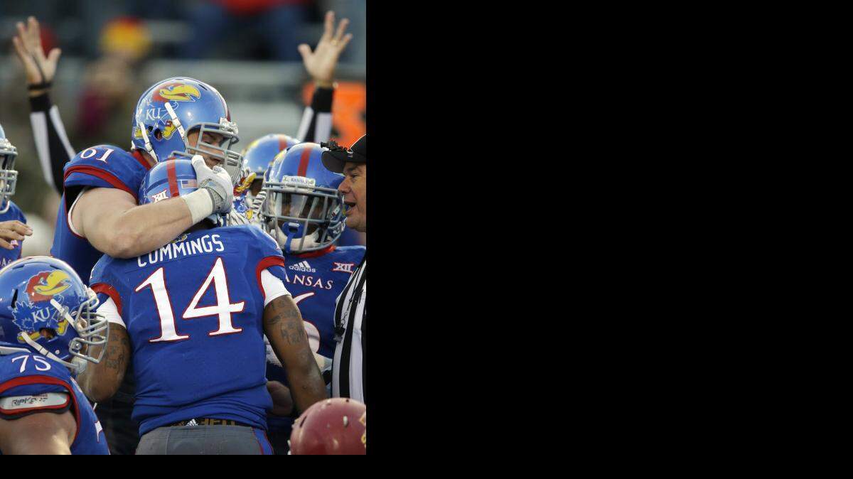 
Senior offensive lineman Pat Lewandowski, who gave quarterback Michael Cummings a hug after a touchdown against Iowa State earlier this month, will be playing his last game for Kansas on Saturday at Kansas State.


