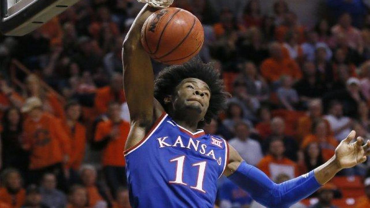 Kansas’ Josh Jackson dunked in front of Oklahoma State’s Jawun Evans in the second half of the Jayhawks’ 90-85 win Saturday in Stillwater, Okla.