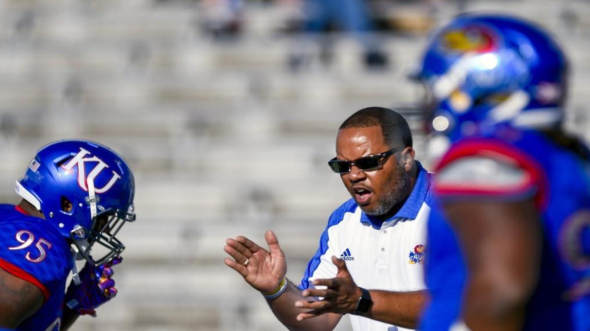 Michael Slater talked to players before the start of the Jayhawks’ season opener against the Rhode Island.
