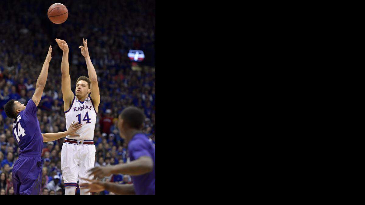 
KU's Brannen Greene made three three-pointers against Kansas State, this one over K-State’s Justin Edwards on Saturday at Allen Fieldhouse.


