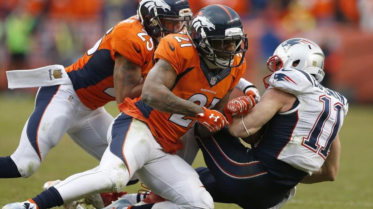 Denver cornerbacks Chris Harris (behind) and Aqib Talib stopped New England wide receiver Julian Edelman during the second half of the AFC Championship game Jan. 24 in Denver.