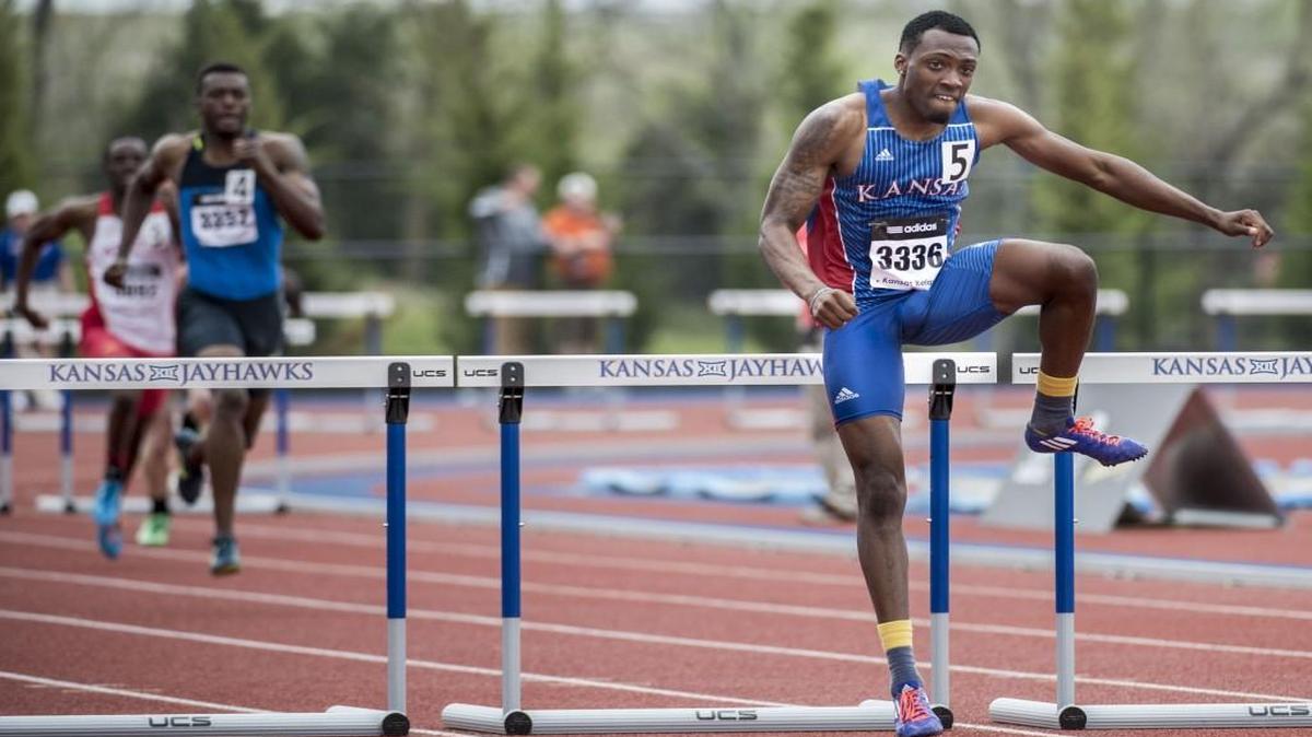 Michael Stigler (right) cleared the last hurdle in the last heat of the 400-meter hurdles during the Kansas Relays at Rock Chalk Park last year in Lawrence.