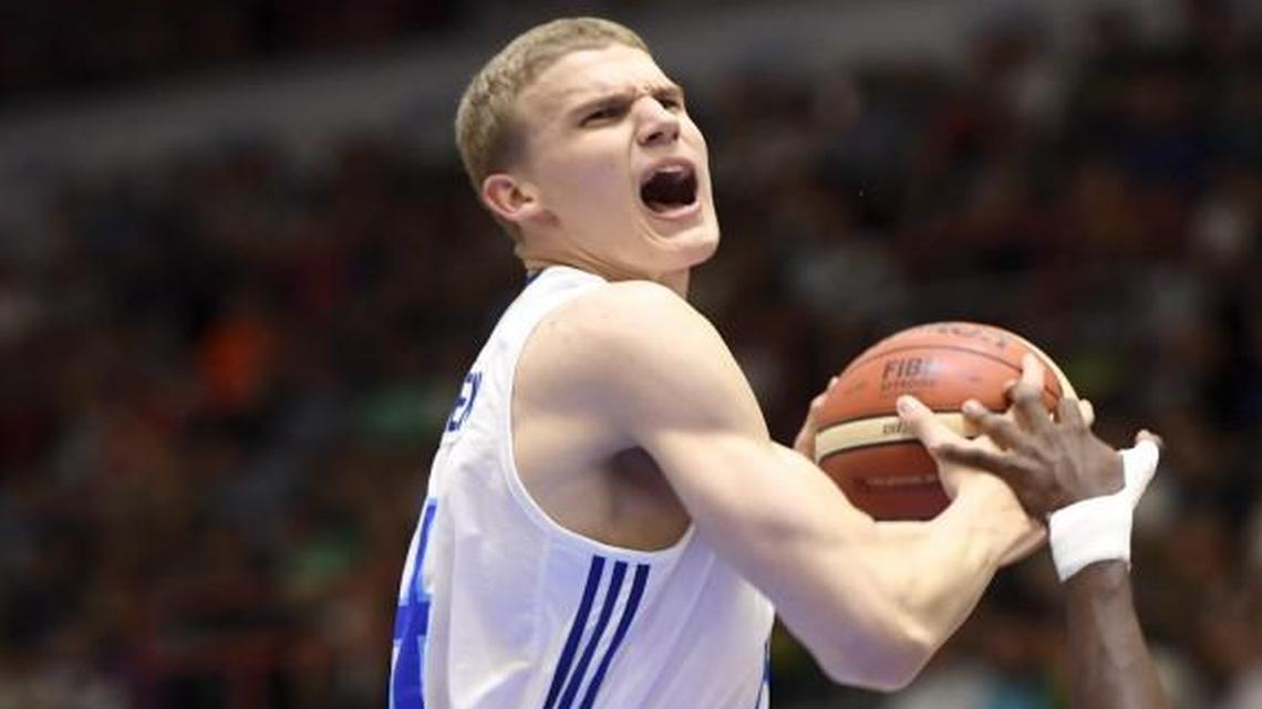 Pekka Markkanen played at KU one season. Now draft experts are saying his son, Lauri, is ticketed for just one year at Arizona before heading to the NBA Draft. Lauri Markkanen (left) is pictured playing for Finland against France in a FIBA U20 European Championship Tournament game in July in Helsinki, Finland.