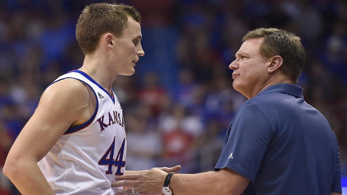 KU coach Bill Self (right) had a word with freshman Mitch Lightfoot during the second half of Tuesday’s exhibition game against Washburn at Allen Fieldhouse in Lawrence.
