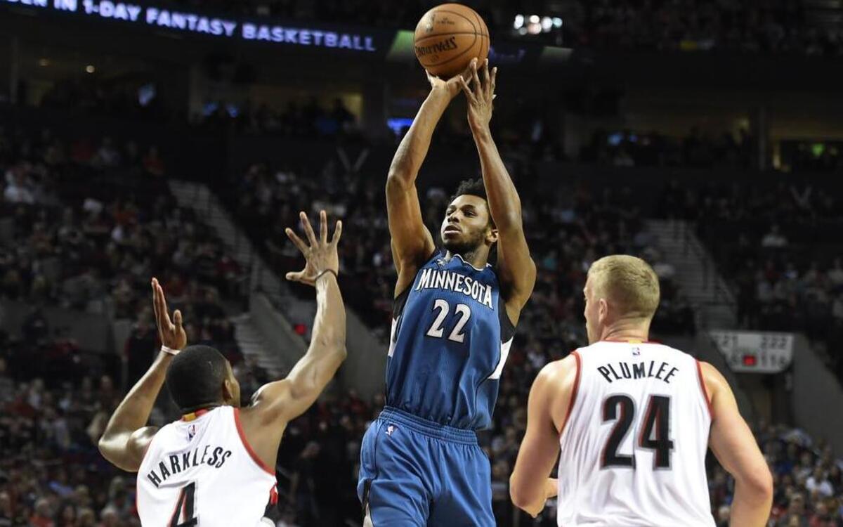 Minnesota Timberwolves guard Andrew Wiggins took a shot over Portland Trail Blazers forward Maurice Harkless (left) and center Mason Plumlee in a game in Portland, Ore., in April.