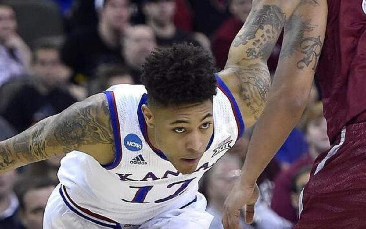 
KU’s Kelly Oubre (left) drove by New Mexico State's Remi Barry on his way to the basket during an NCAA Tournament game in 2015 in Omaha.
