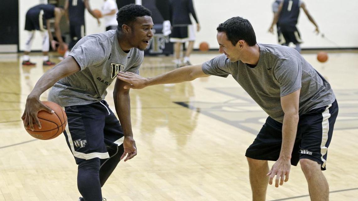 Former KU player Brett Ballard (right), who is now Washburn’s head coach, was a Wake Forest assistant when he coached Bryant Crawford at a media-day practice in 2015.