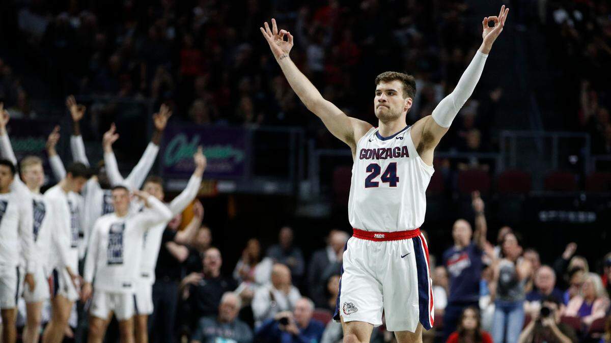 Gonzaga’s Corey Kispert (24) celebrates after a teammate scored a 3-point shot against Saint Mary’s in the first half of an NCAA college basketball game in the final of the West Coast Conference men’s tournament in Las Vegas, in this Tuesday, March 10, 2020, file photo. The 6-foot-7 Kispert earned preseason AP All-America honors as he begins his final season with the top-ranked Bulldogs.