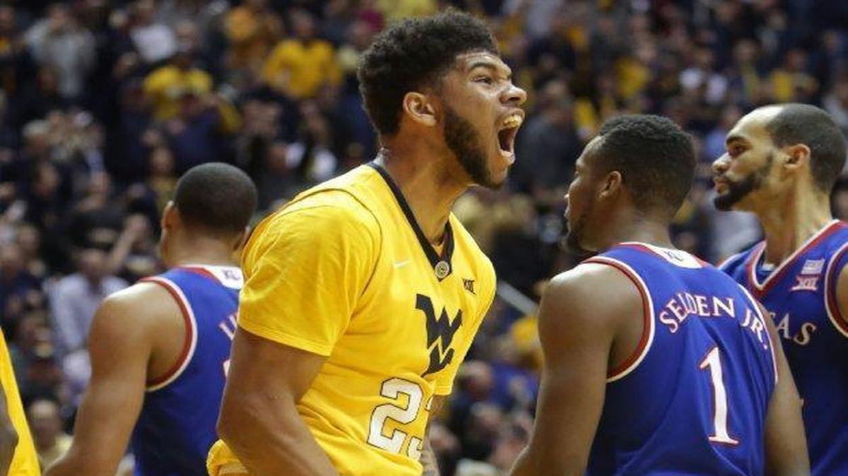 Esa Ahmad and West Virginia defeated Kansas 74-63 at home last season. Ahmad will be in the lineup Tuesday night as the Mountaineers try to make it four in a row over the Jayhawks in Morgantown, W.Va.