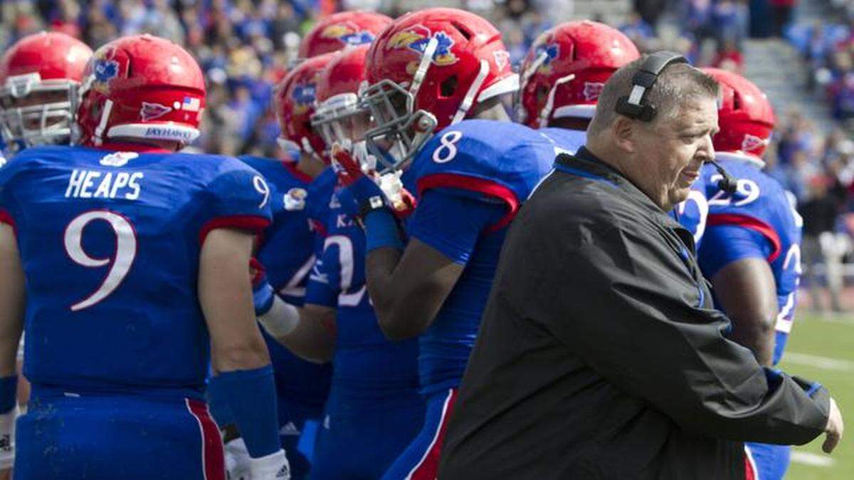 
Jake Heaps (left) is one of the quarterbacks that didn’t pan out for Kansas coach Charlie Weis in his first two seasons at KU.
