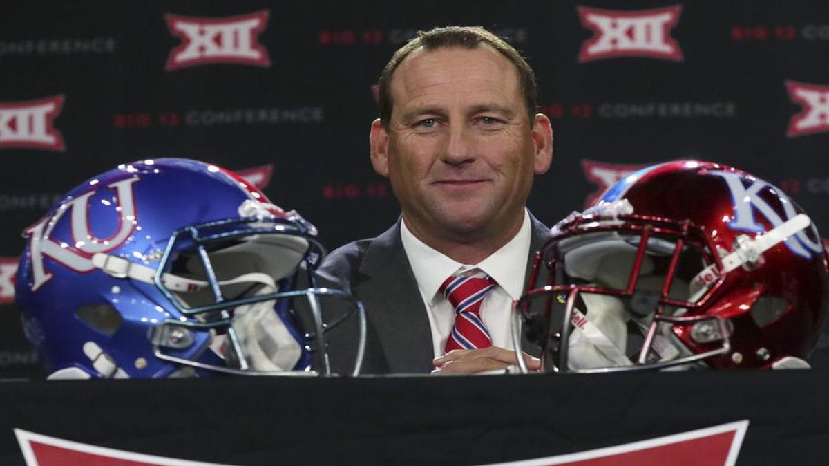 Kansas head coach David Beaty took his seat before speaking to reporters during the Big 12 NCAA college football media day in Frisco, Texas, on Monday, July 17, 2017.