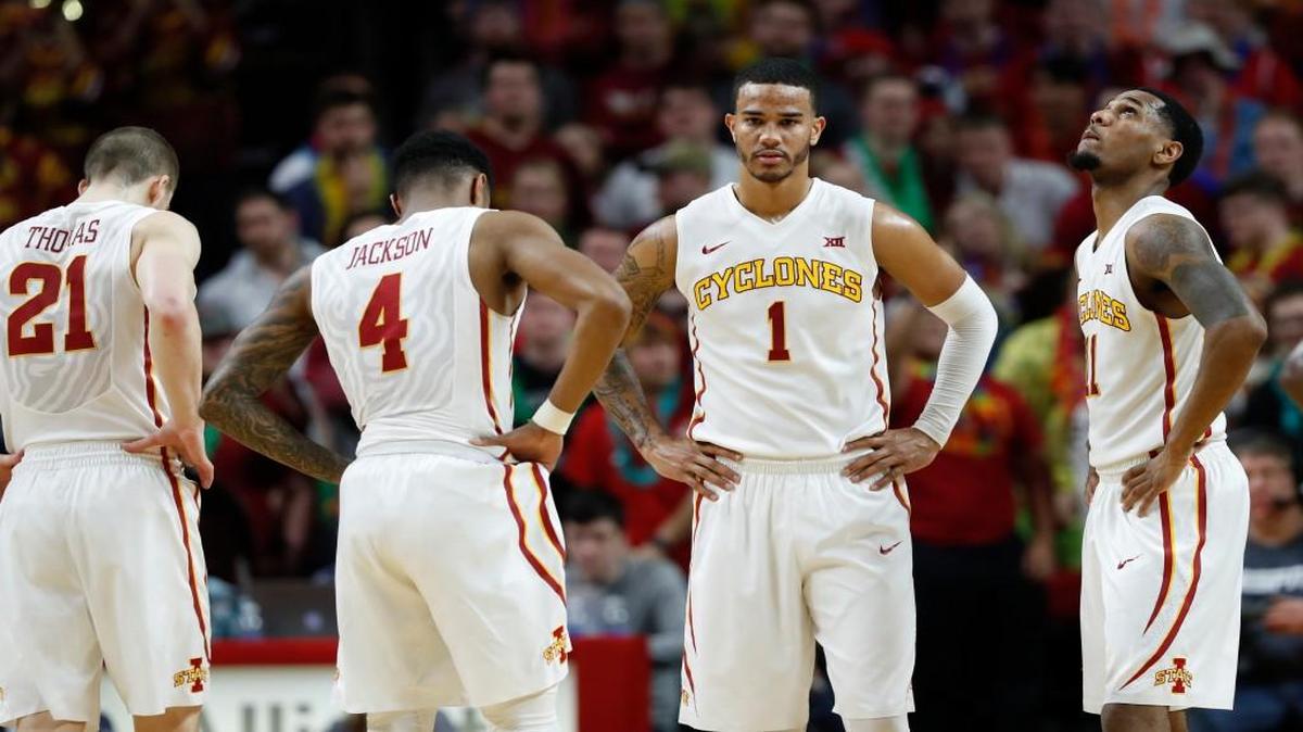 Iowa State guard Nick Weiler-Babb (1) stands on the court with teammates Matt Thomas (21), Donovan Jackson (4) and Monte Morris, right, during the second half of a game against West Virginia, Tuesday, Jan. 31.
