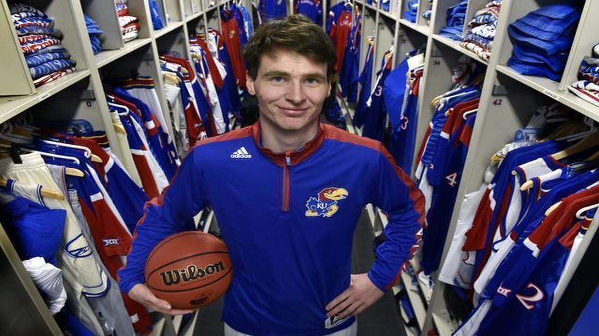 
Chris Huey, a student manager for the Kansas Jayhawks men’s basketball team, also takes the floor during practice as a member of the scout team. Huey, a senior attended Bishop Ward High School in Kansas City, Kan. He was photographed inside the equipment room, or what he calls his office, inside Allen Fieldhouse.
