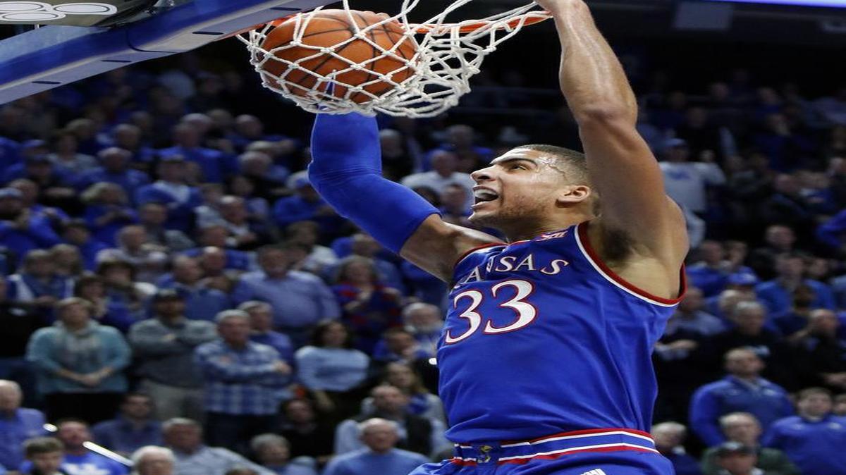 Kansas' Landen Lucas dunks during the second half of an NCAA college basketball game against Kentucky, Saturday, Jan. 28, 2017, in Lexington, Ky. Kansas won 79-73.