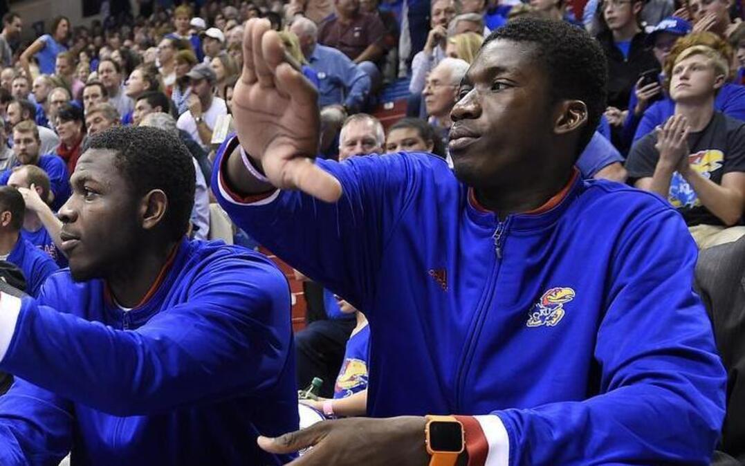 KU freshman Cheick Diallo (right) did not play Friday night.