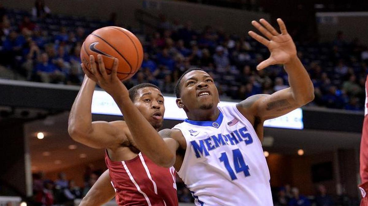 Former Memphis forward K.J. Lawson (center)