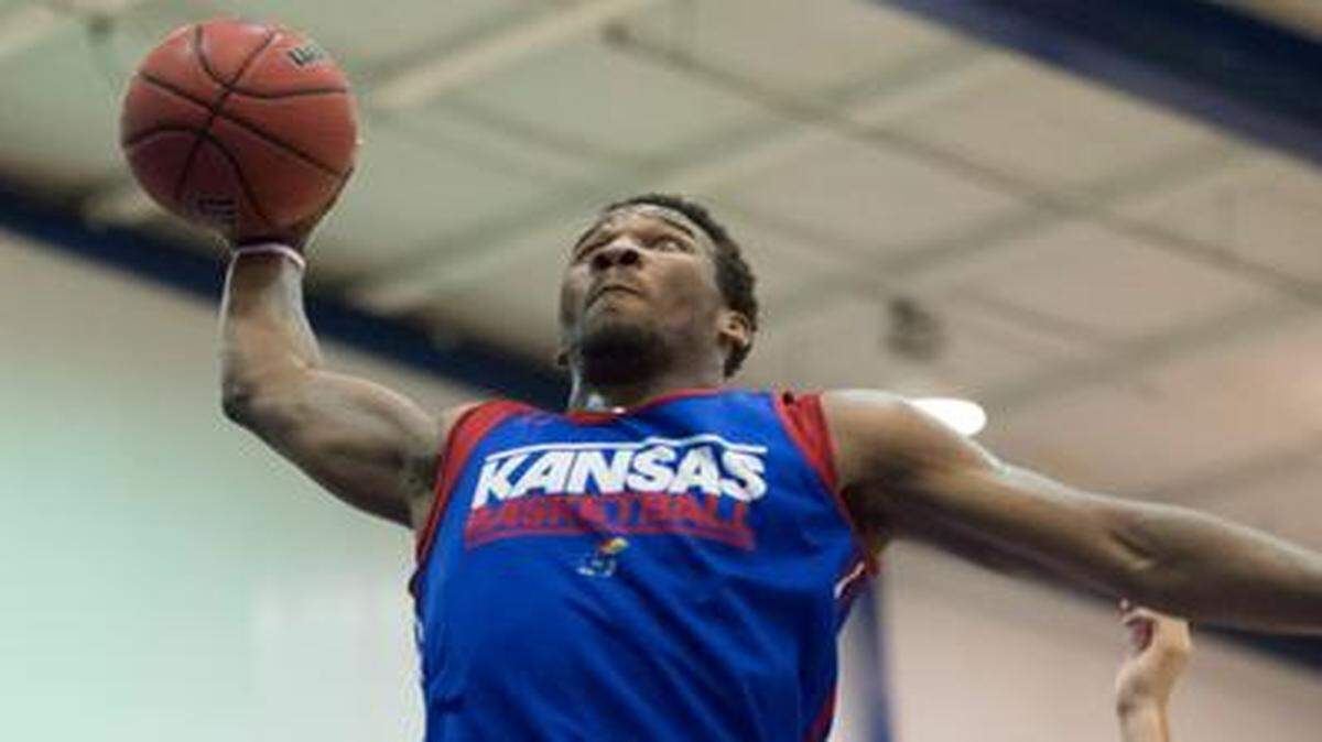
Wayne Selden, Jr. (left) drove for a lay-up on Wednesday during Bill Self’s annual camp scrimmage. 
