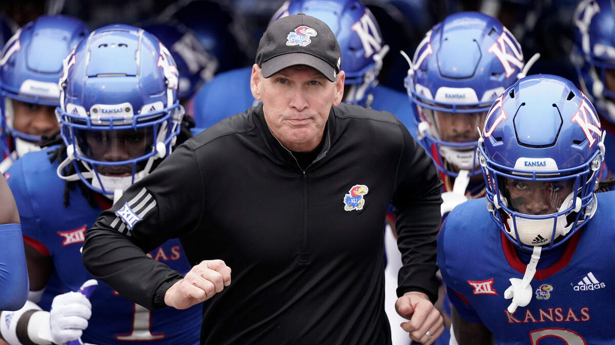 Kansas head coach Lance Leipold leads his team onto the field before a game against Oklahoma Saturday, Oct. 23, 2021, in Lawrence, Kan.