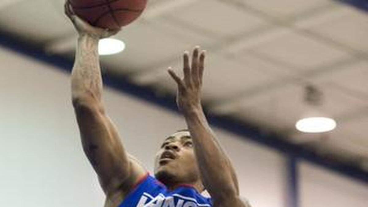 
Kansas guard Frank Mason (left) shot over Kelly Oubre (right) during the annual scrimmage held at the end of Bill Self's camp at the Horesji Center on Wednesday in Lawrence.
