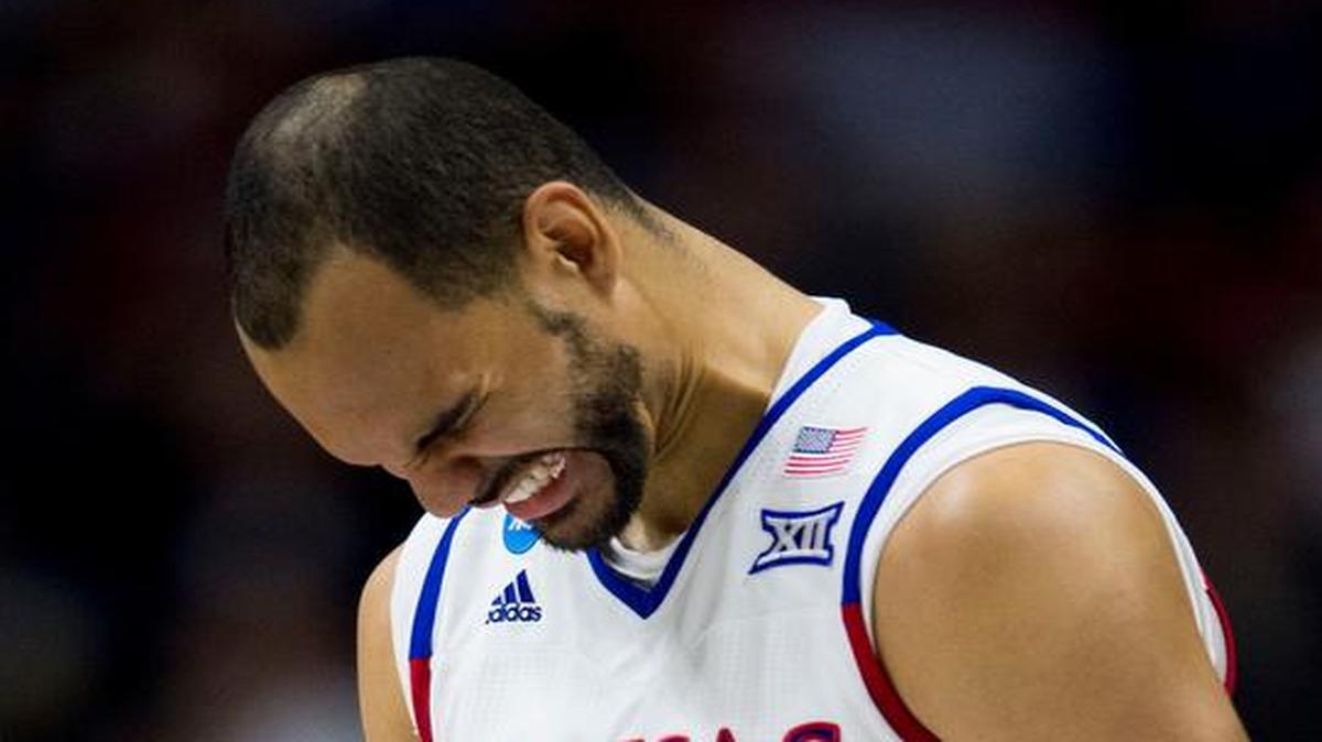 KU’s Perry Ellis (left) winced as he walked back to the bench in the first half, but he returned to the game.