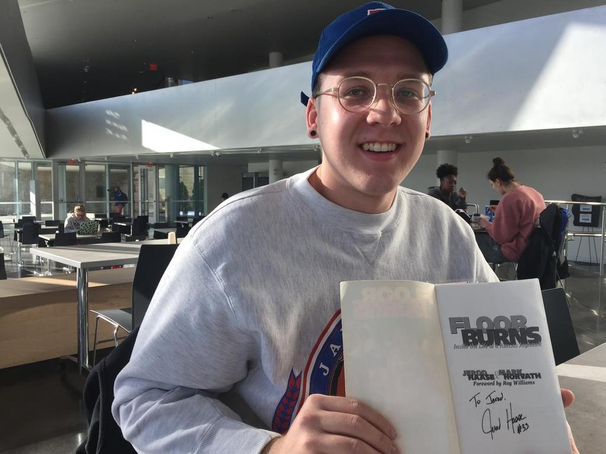 Kansas student Jerod Dyke, 20, displays a signed “Floor Burns” book from former KU guard and current Stanford coach Jerod Haase. Dyke, who was born in Lawrence and raised in Oklahoma, was named after Haase by his parents.
