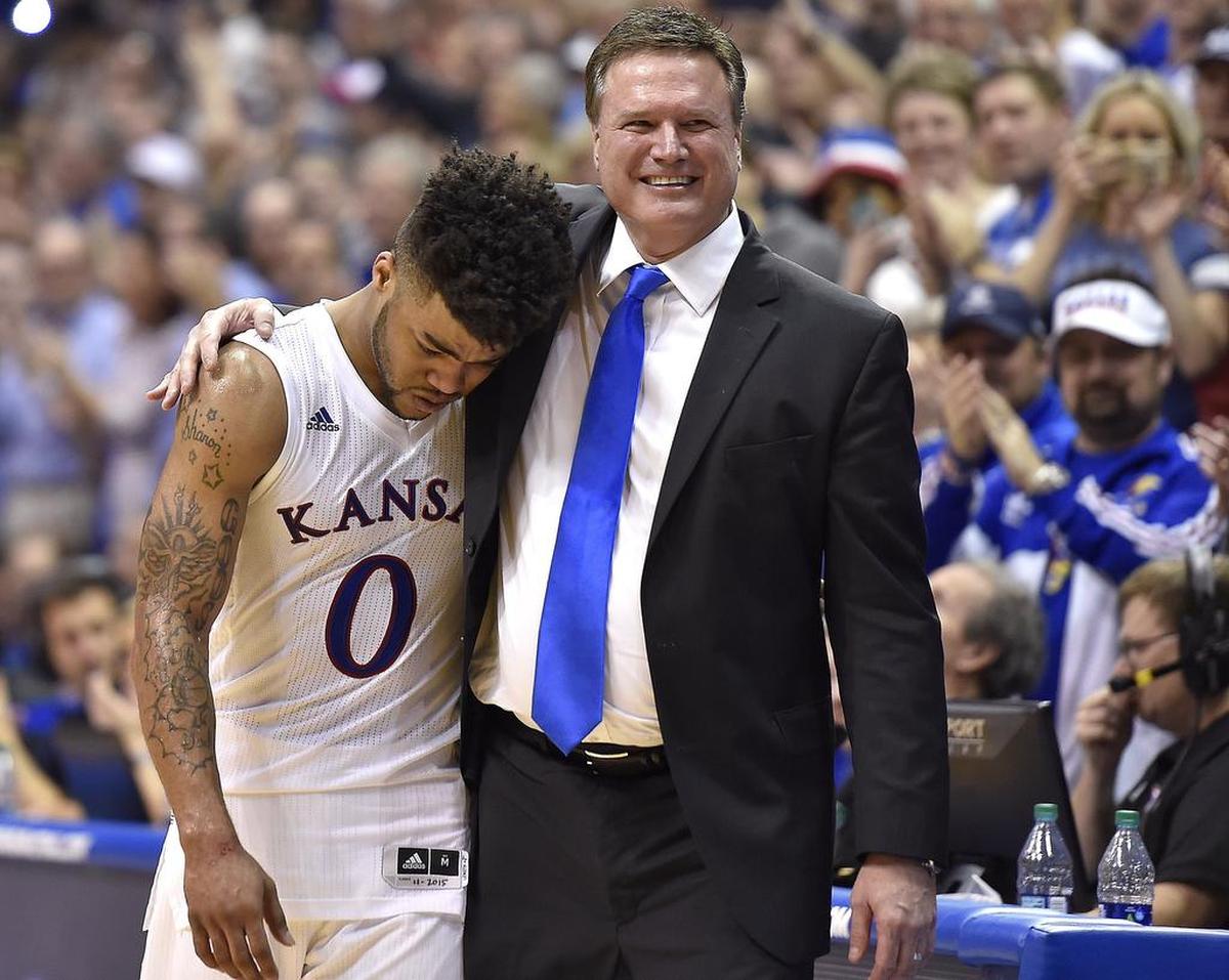 KU senior point guard Frank Mason (left) fought back tears on Senior Night while leaving the game after the Jayhawks’ 73-63 come-from-behind win over OU on Feb. 27, 2017 at Allen Fieldhouse.