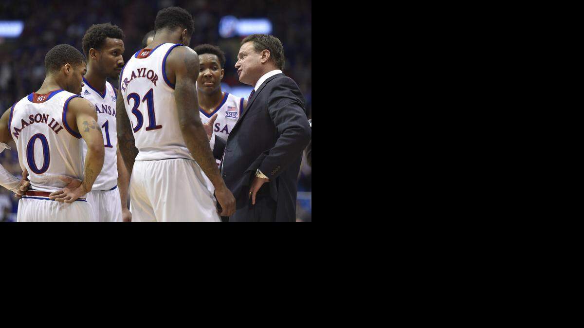 
Kansas coach Bill Self talks to his squad during a break in the action during the second half of Tuesday night's game at Allen Fieldhouse in Lawrence, Kans. KU won, 67-57.
