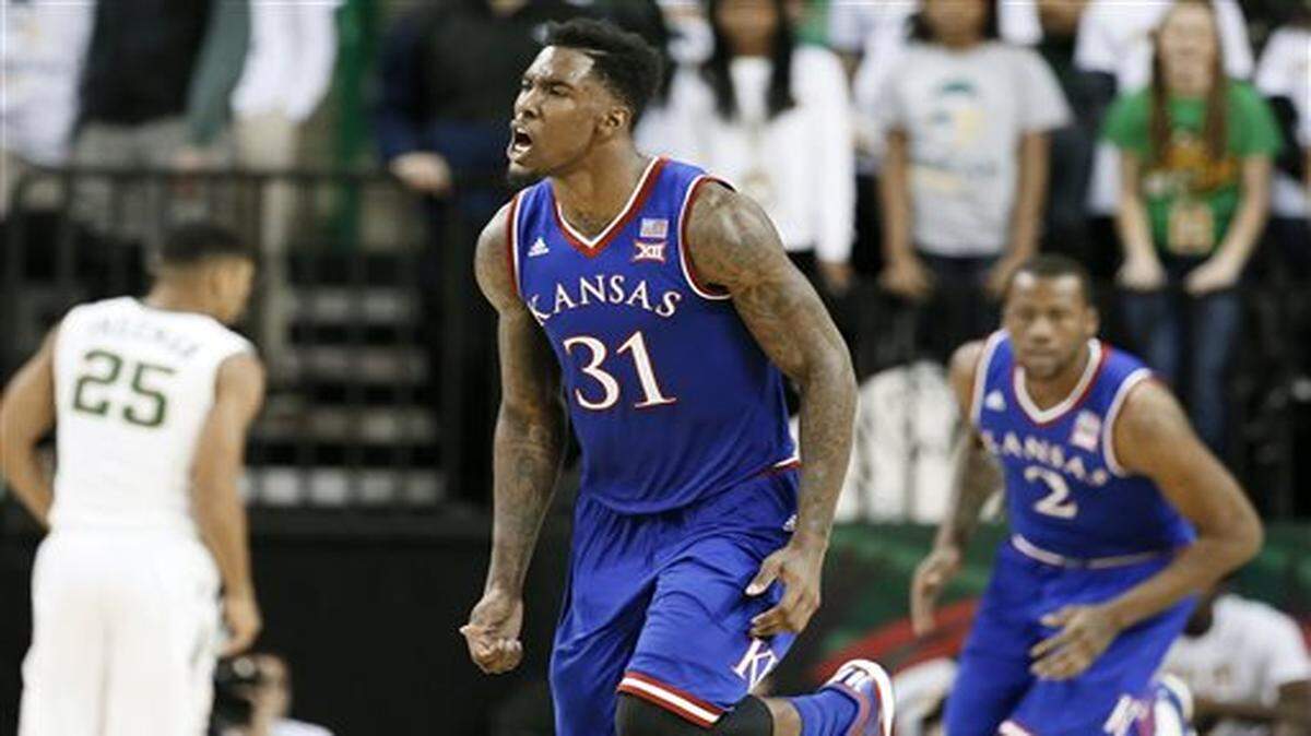 
Kansas's Jamari Traylor (31) celebrates a score against Baylor in the second half of an NCAA college basketball game, Wednesday, Jan. 7, 2015, in Waco, Texas. Traylor lead the team in scoring with 13-points in the 56-55 Kansas win. (AP Photo/Tony Gutierrez)
