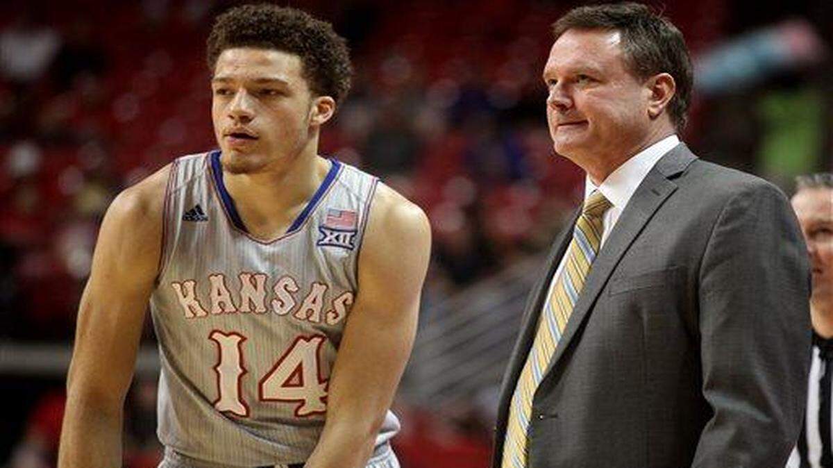 
Kansas head coach Bill Self talks with Brannen Greene during the NCAA college basketball game with Texas Tech in Lubbock, Texas, Tuesday, Feb. 10, 2015. (AP Photo/Zach Long)
