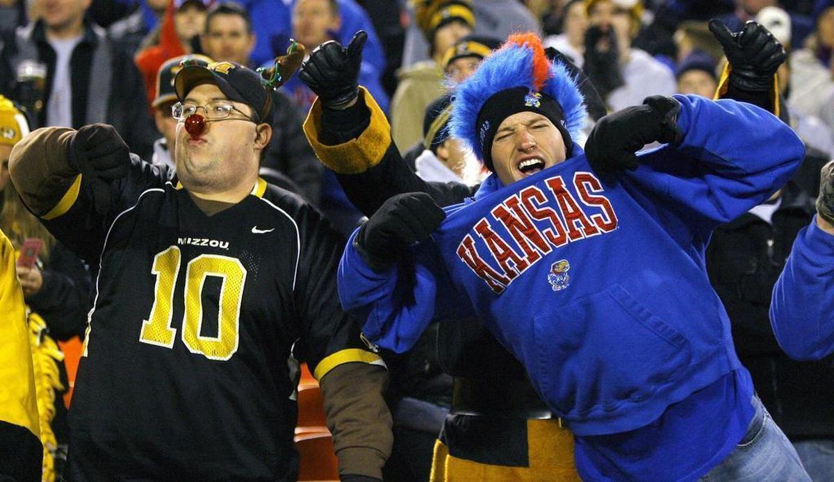 Missouri fans and their Kansas counterparts, including John Miller of St. Louis (left) and Craig Wiebe of Summerfield, Kan., strutted their stuff before the game.