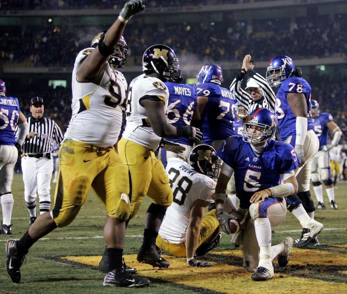 In one of the most iconic images of the 2007 KU-MU game, Jayhawks quarterback Todd Reesing looked up with a facemask full of mud after being sacked for a safety in the fourth quarter. Had the 12-team CFP playoff proposal been in place that season, both teams would have made the field.