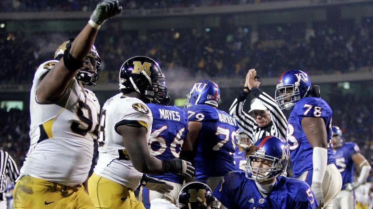 In one of the most iconic images of the 2007 KU-MU game, Jayhawks quarterback Todd Reesing looked up with a facemask full of mud after being sacked for a safety in the fourth quarter. Had the 12-team CFP playoff proposal been in place that season, both teams would have made the field.